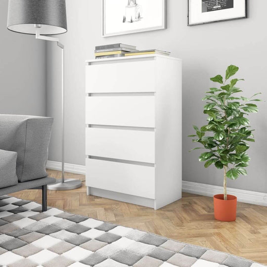 Modern white sideboard with four drawers in a stylish living room setting, featuring indoor plants and a cozy atmosphere.