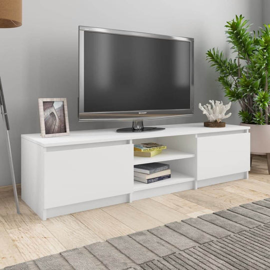 White TV cabinet with two doors and open shelves, featuring a television and plants in a stylish living room setting.