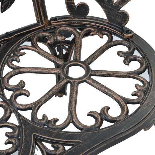 Detailed scrollwork design of the Bistro Bench featuring ornate floral patterns in bronze cast aluminium.