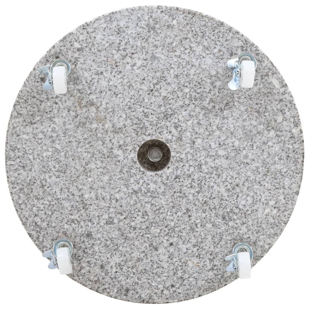 Round grey granite parasol base with four locking wheels for outdoor furniture stability.