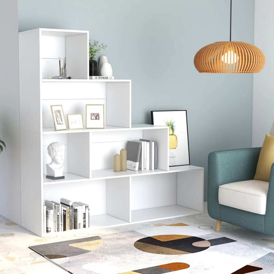 Modern white book cabinet and cozy living area with decorative items, showcasing stylish furniture for home decor.