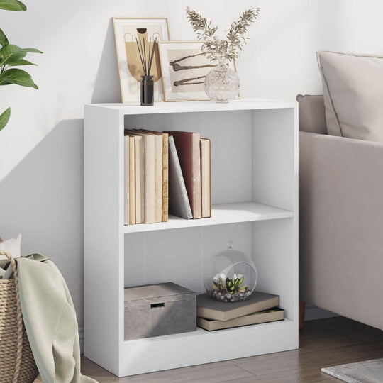 White engineered wood bookshelf with books and decor in a modern living room setting.