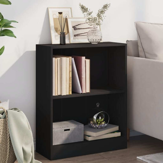 Compact black bookshelf with books and decorative items, enhancing modern indoor decor and functionality.