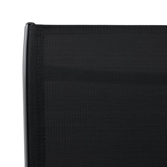 Close-up of the black textilene fabric on a garden bar chair, ideal for outdoor furniture in patios and balconies.