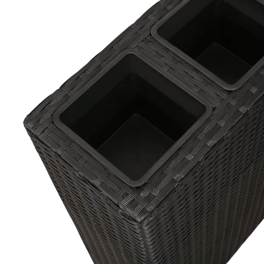 Close-up of a black rattan garden planter with two removable pots for outdoor plants and flowers.