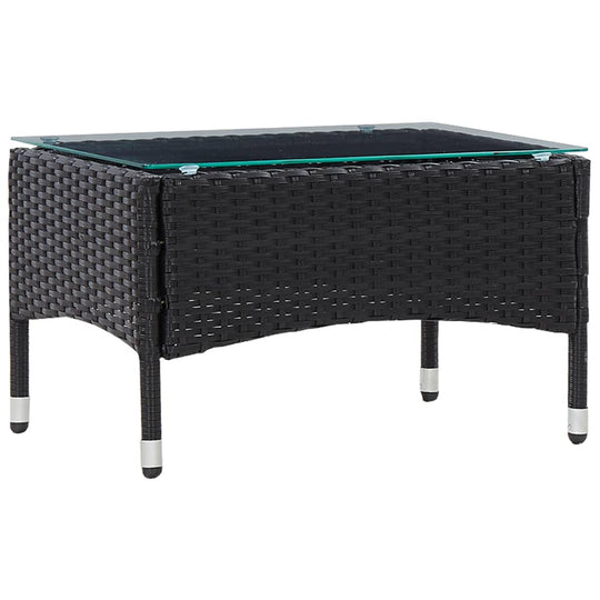 Black poly rattan coffee table with glass top, perfect for outdoor furniture and lounging. Durable and easy to clean.