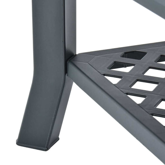 Close-up of the durable plastic leg and storage shelf design of a green outdoor coffee table. Perfect for stylish outdoor furniture.