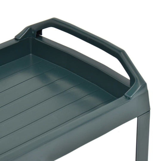 Close-up of the green plastic beverage cart's top surface and handle, ideal for outdoor furniture use.