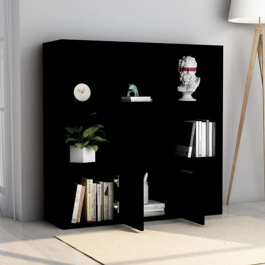 Black engineered wood book cabinet with open cubes and doors, stylish storage for books and decor in modern interior.