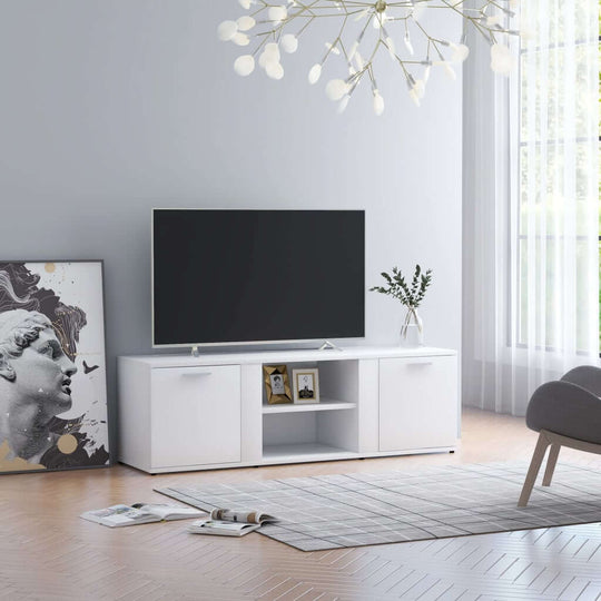 White engineered wood TV cabinet with 2 doors and open shelves, perfect for home decor, supporting a TV in a stylish living room setting.