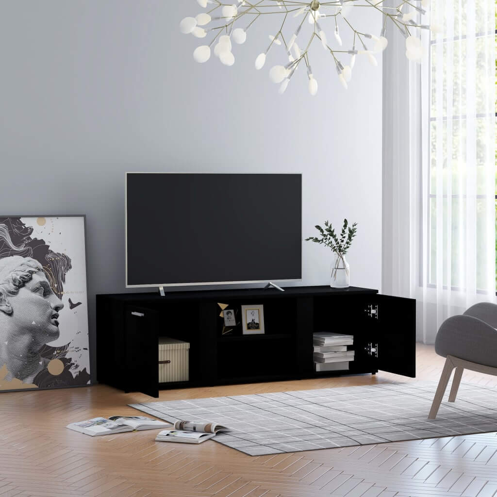 Stylish black TV cabinet with open compartments, perfect for multimedia storage in a modern living room setting.