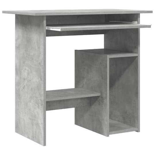 Sleek concrete grey desk made of engineered wood with open shelves, ideal for compact workspaces and study areas.