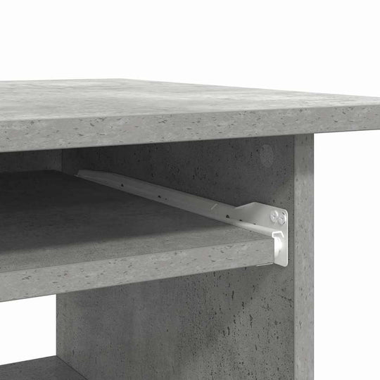 Close-up of engineered wood desk showing sturdy concrete grey finish and open shelf with support bracket for added durability.