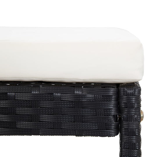 Close-up of a black poly rattan outdoor bench with a white cushion, showcasing elegant and durable design for outdoor furniture.