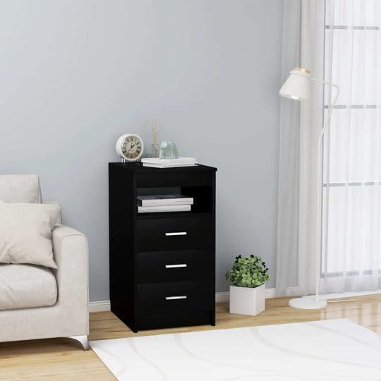 Black drawer cabinet with three drawers and open shelf in modern lounge setting, perfect for stylish storage.