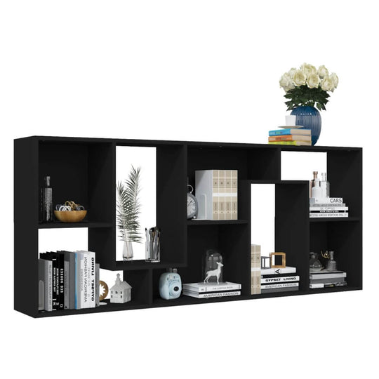 Black book cabinet with spacious compartments showcasing books, decor, and a vase of flowers, stylish furniture piece.