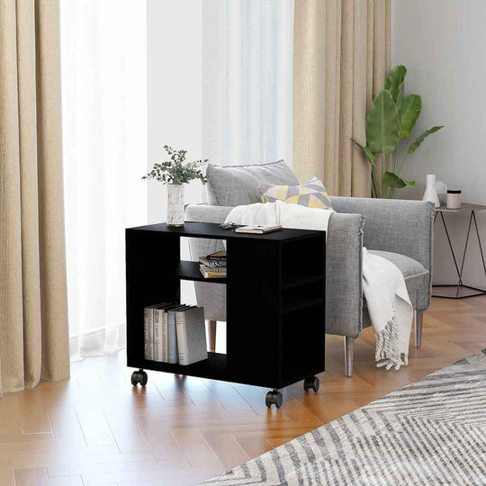 Stylish black side table on wheels beside a gray sofa, perfect for magazines and decor in a modern living room setting.