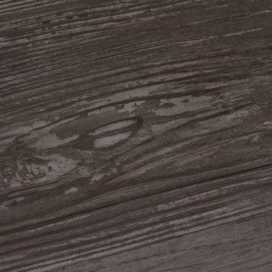 Close-up view of dark striped wood texture on PVC flooring planks, showcasing natural grain details and finish.