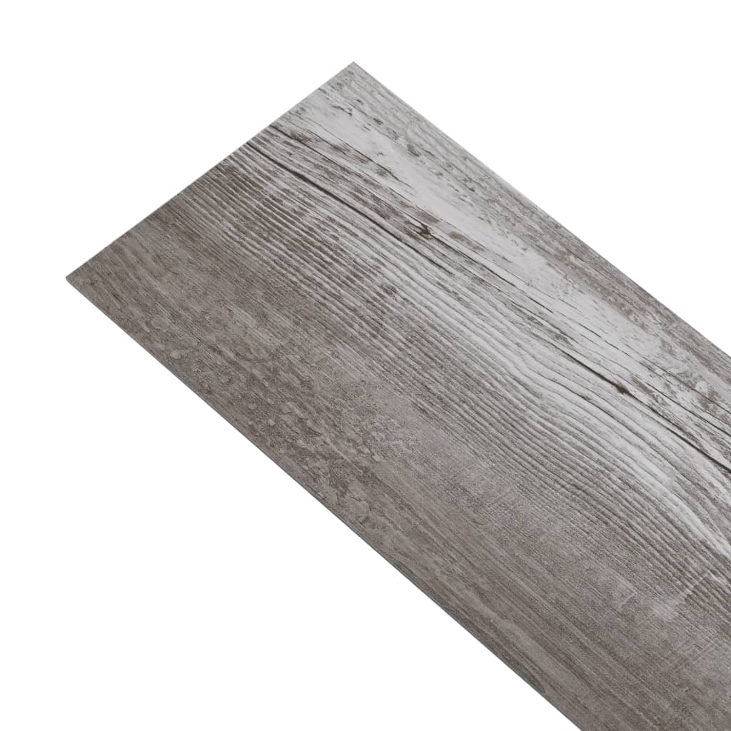 Self-adhesive PVC flooring plank in matt wood brown finish, showcasing textured surface and natural wood appearance.