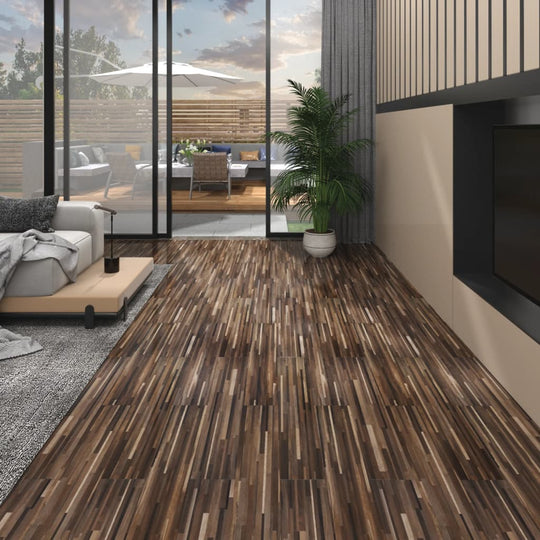 Modern living room featuring PVC self-adhesive flooring planks in striped brown pattern, with stylish furniture and greenery.