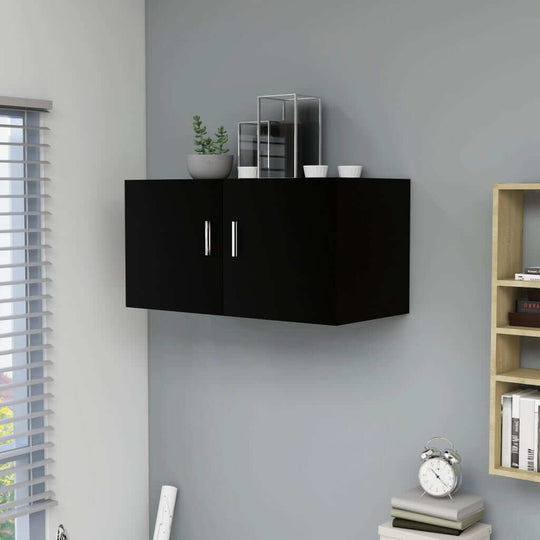 Wall mounted black cabinet with two doors and decorative plants, perfect for stylish storage in modern interiors.