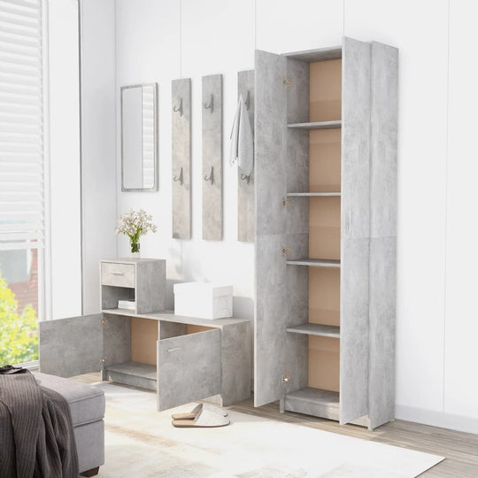 Hallway wardrobe in concrete grey with multiple compartments in a modern living space, showcasing sleek furniture design.