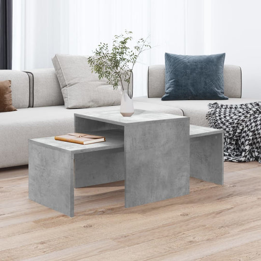 Modern concrete grey coffee table set in a stylish lounge, perfect for drinks and decor, enhancing your home with elegant أثاث.