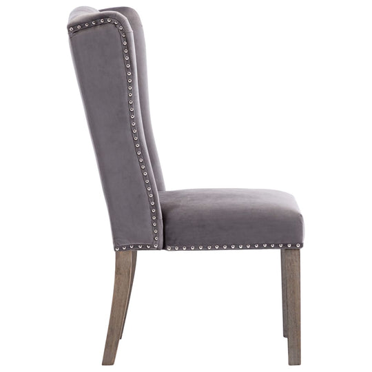 Side view of a stylish Dining Chairs  pcs  Velvet with decorative rivets and solid rubberwood legs.