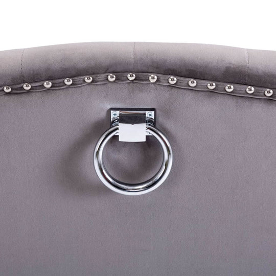 Close-up of the backrest of Dining Chairs  pcs  Velvet with decorative metal rivets and a stylish circular handle.