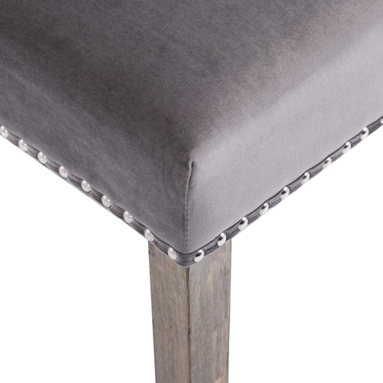 Dining Chairs  pcs  Velvet close-up of soft grey velvet upholstery with decorative metal rivets on the edge.
