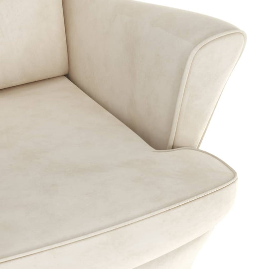 Close-up of cream white velvet armchair showcasing soft upholstery and elegant design for modern home decor.