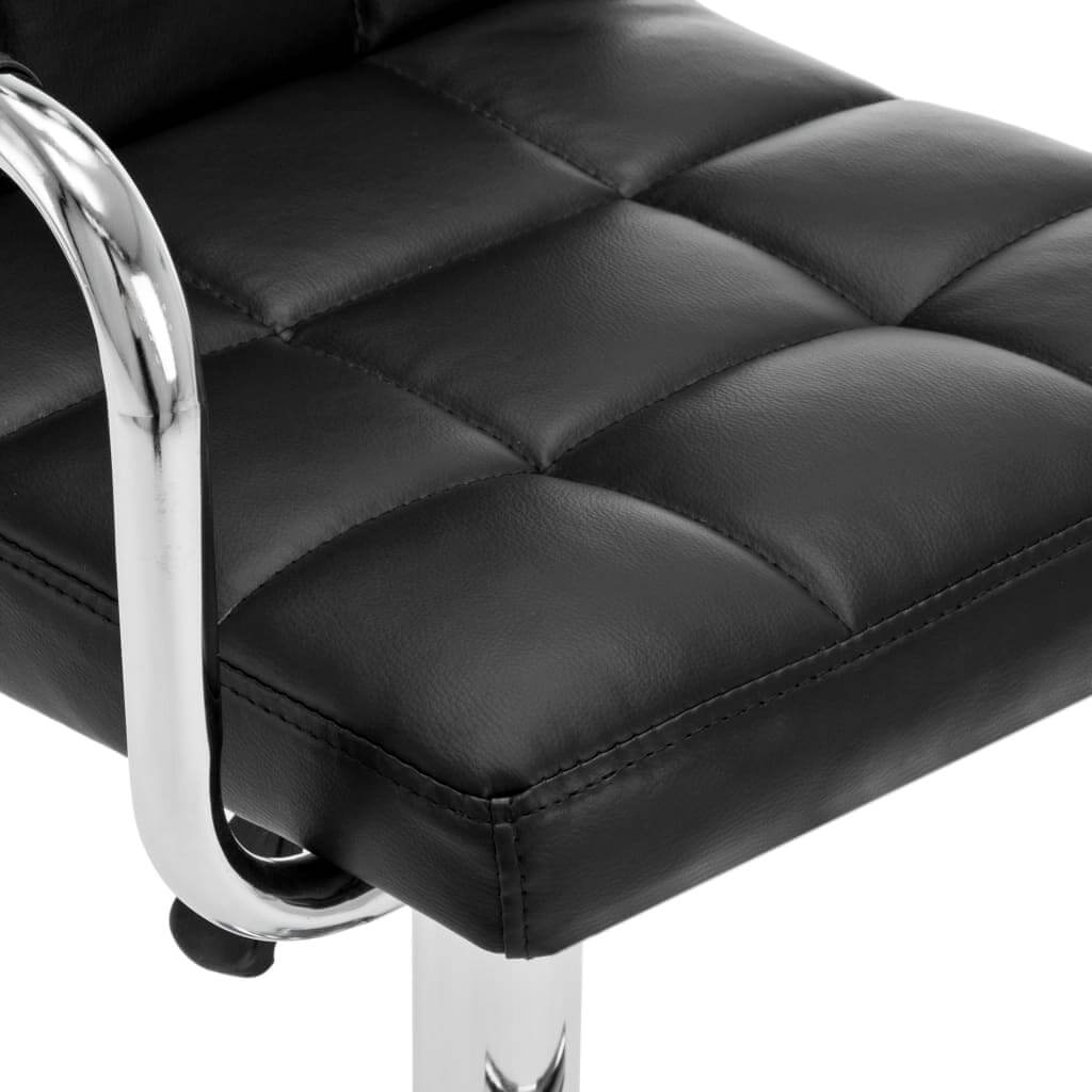 Close-up of black faux leather bar stool with chrome frame, perfect for modern outdoor and indoor settings.