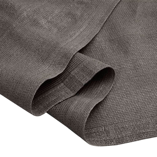 Close-up of anthracite tent carpet fabric, showcasing texture and edge detail for outdoor comfort and durability.