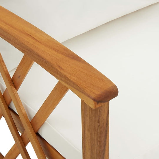 Close-up of solid acacia wood armrest on garden chair with plush white cushion, showcasing craftsmanship and durability.