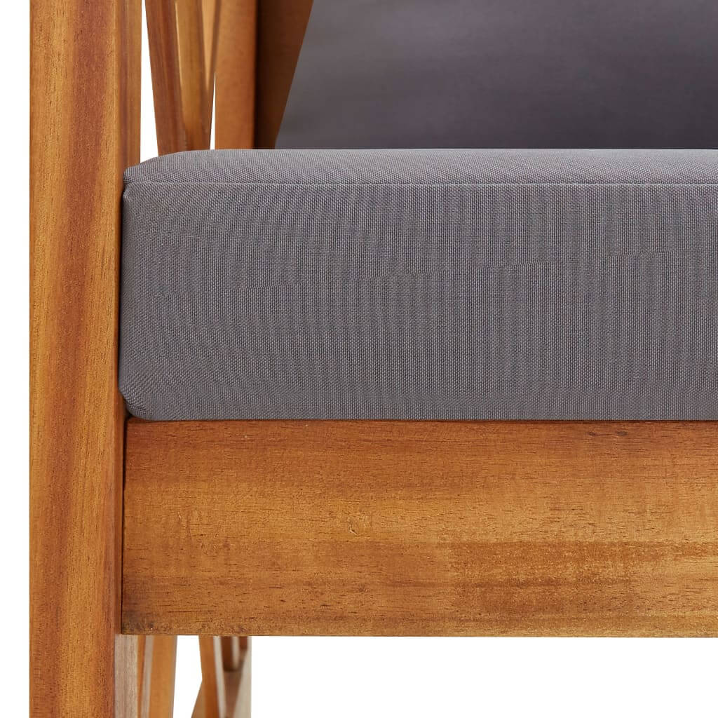 Close-up of cushioned seat on a solid acacia wood garden bench, showcasing outdoor furniture design and durability.