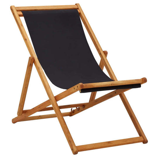 Folding beach chair made of eucalyptus wood with black fabric, perfect for outdoor lounges and camping trips.