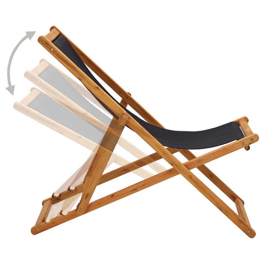 Folding beach chair in eucalyptus wood with adjustable reclining settings and black weather-resistant fabric.