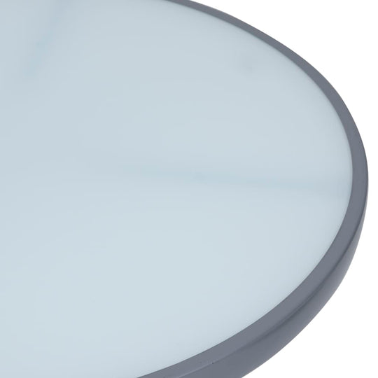 Close-up of the light grey glass tabletop of a round garden table, showcasing its smooth surface and elegant design.