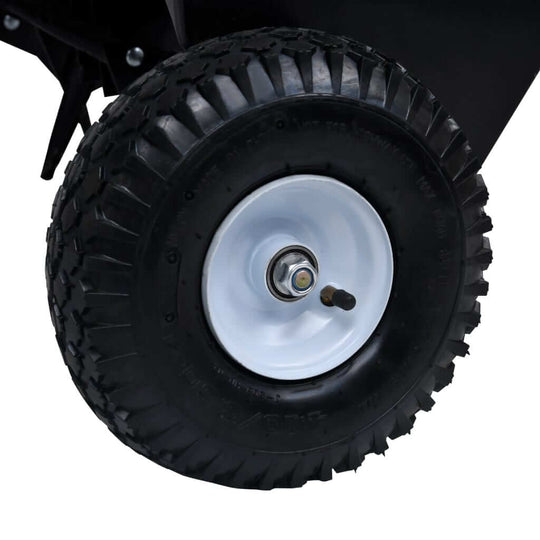 Close-up of a durable tire on a ride-on mower lawn aerator, designed for easy maneuverability and optimal performance.