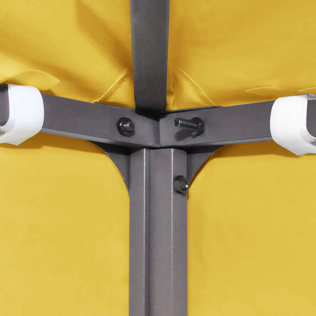 Close-up of gazebo top cover’s reinforced corner and support structure in yellow, showcasing durability and water resistance.