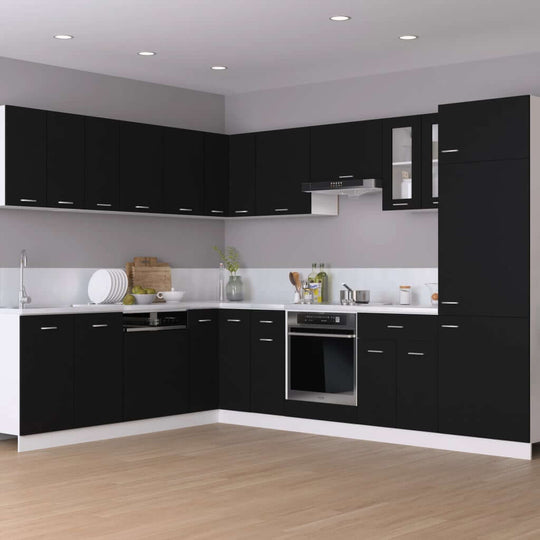 Modern black kitchen with sleek cabinets, appliances, and ample counter space for an organized cooking area.