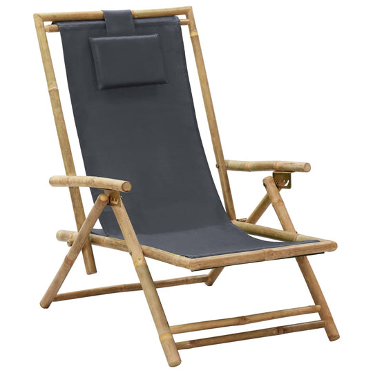 Dark grey bamboo and fabric reclining chair with adjustable backrest and pillow for outdoor relaxation.