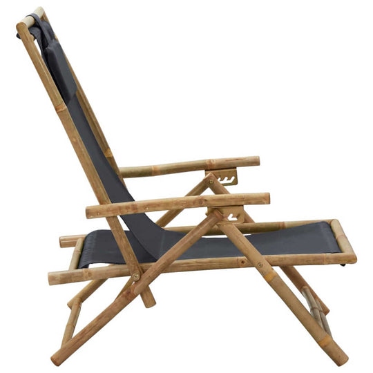 Dark grey bamboo folding relaxing chair with adjustable backrest for outdoor comfort and leisure. Perfect for lounging.