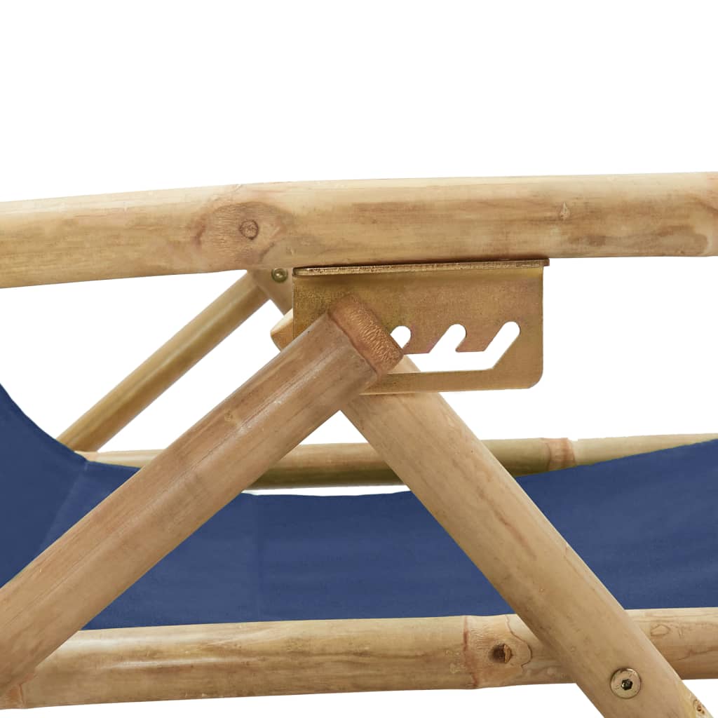 Close-up of the sturdy bamboo frame and adjustable mechanism of a navy blue outdoor relaxing chair.