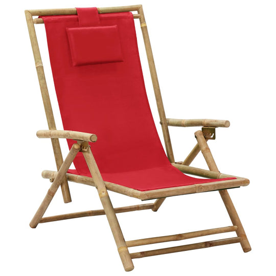 Red bamboo folding relaxing chair with fabric seat and adjustable backrest for comfort. Perfect for outdoor relaxation.