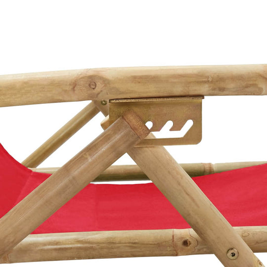 Close-up of the adjustable mechanism on the red bamboo and fabric reclining relaxing chair, highlighting sturdy design.