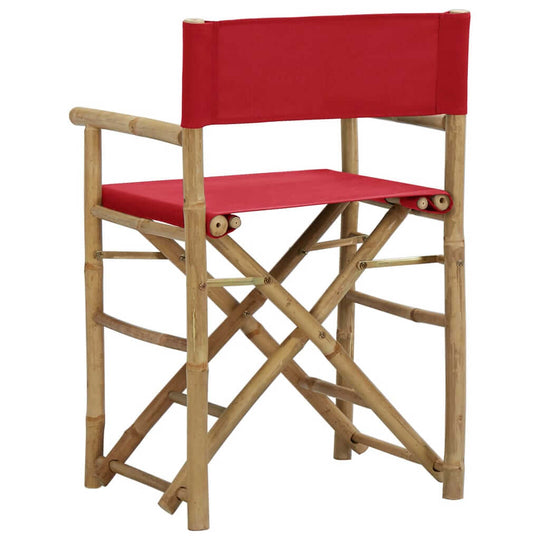 Folding red bamboo director's chair with fabric seat, perfect for outdoor furniture and patio relaxation.