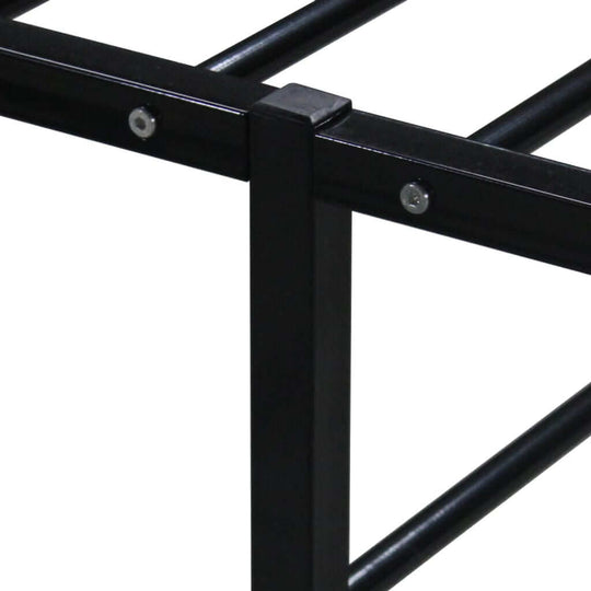 Close-up view of a sturdy black metal bed frame with solid slats for enhanced support and comfort. Ideal for stylish bedroom furniture.