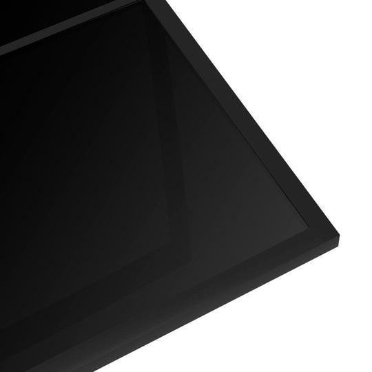 Close-up of a sleek black tempered glass tabletop, highlighting its modern design and easy-clean surface.