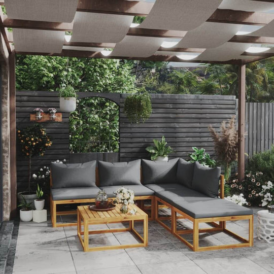 6 piece outdoor lounge set with gray cushions in a garden setting, made from solid acacia wood. Perfect for relaxing with family and friends.